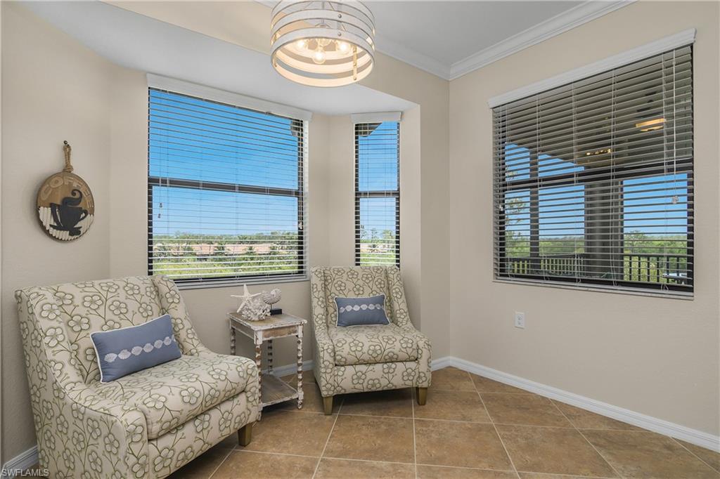 9834 Giaveno Circle, Unit 1746 Naples, FL 34113 - Photo 12 of 41 a living room with furniture and a window