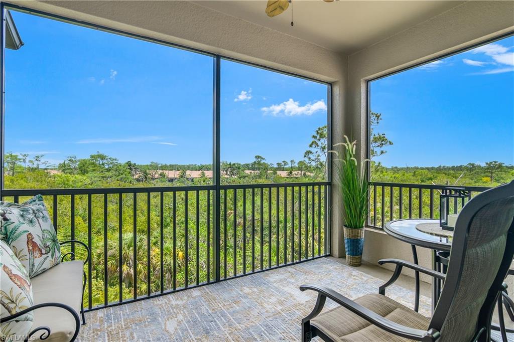 9834 Giaveno Circle, Unit 1746 Naples, FL 34113 - Photo 13 of 41 a view of a two chairs in the balcony