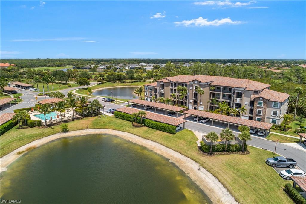 9834 Giaveno Circle, Unit 1746 Naples, FL 34113 - Photo 22 of 41 a view of a city with lawn chairs