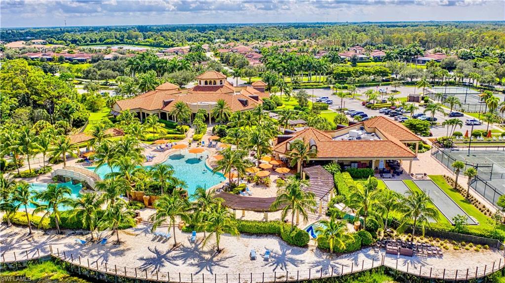 9834 Giaveno Circle, Unit 1746 Naples, FL 34113 - Photo 38 of 41 a view of a garden with a lot of plants and flowers