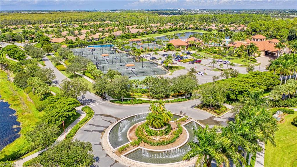 9834 Giaveno Circle, Unit 1746 Naples, FL 34113 - Photo 39 of 41 a view of a swimming pool with a garden