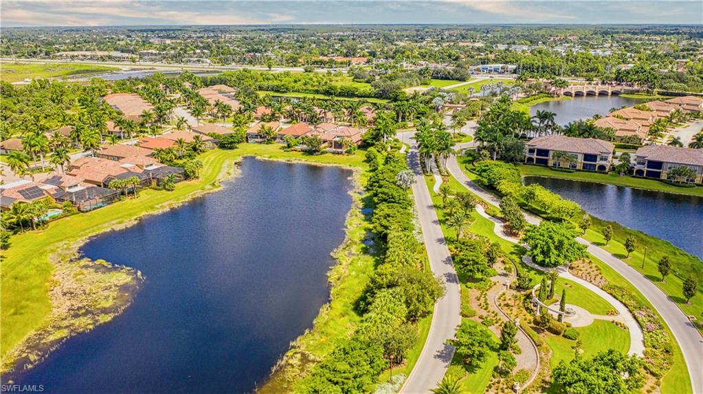 9834 Giaveno Circle, Unit 1746 Naples, FL 34113 - Photo 40 of 41 an aerial view of residential houses with outdoor space