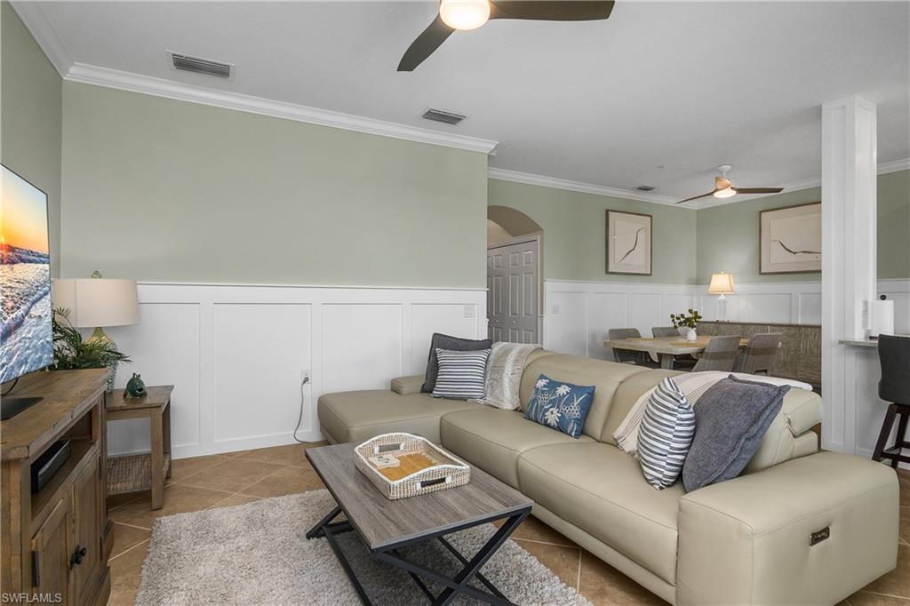 9834 Giaveno Circle, Unit 1746 Naples, FL 34113 - Photo 4 of 41 a living room with furniture and a couch
