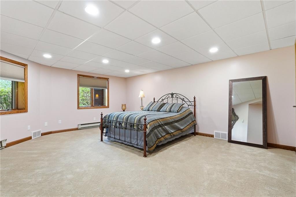 265 McFann Road Valencia, PA 16059 - Photo 40 of 50 a spacious bedroom with a bed and a window