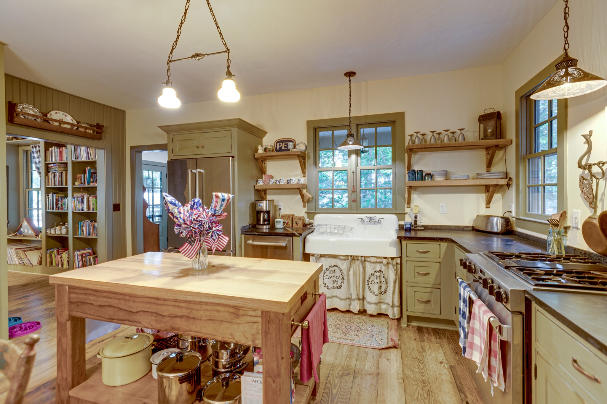 5184 Fire Tower Road Franklin, TN 37064 - Photo 18 of 53 a kitchen with stainless steel appliances granite countertop a sink stove and refrigerator