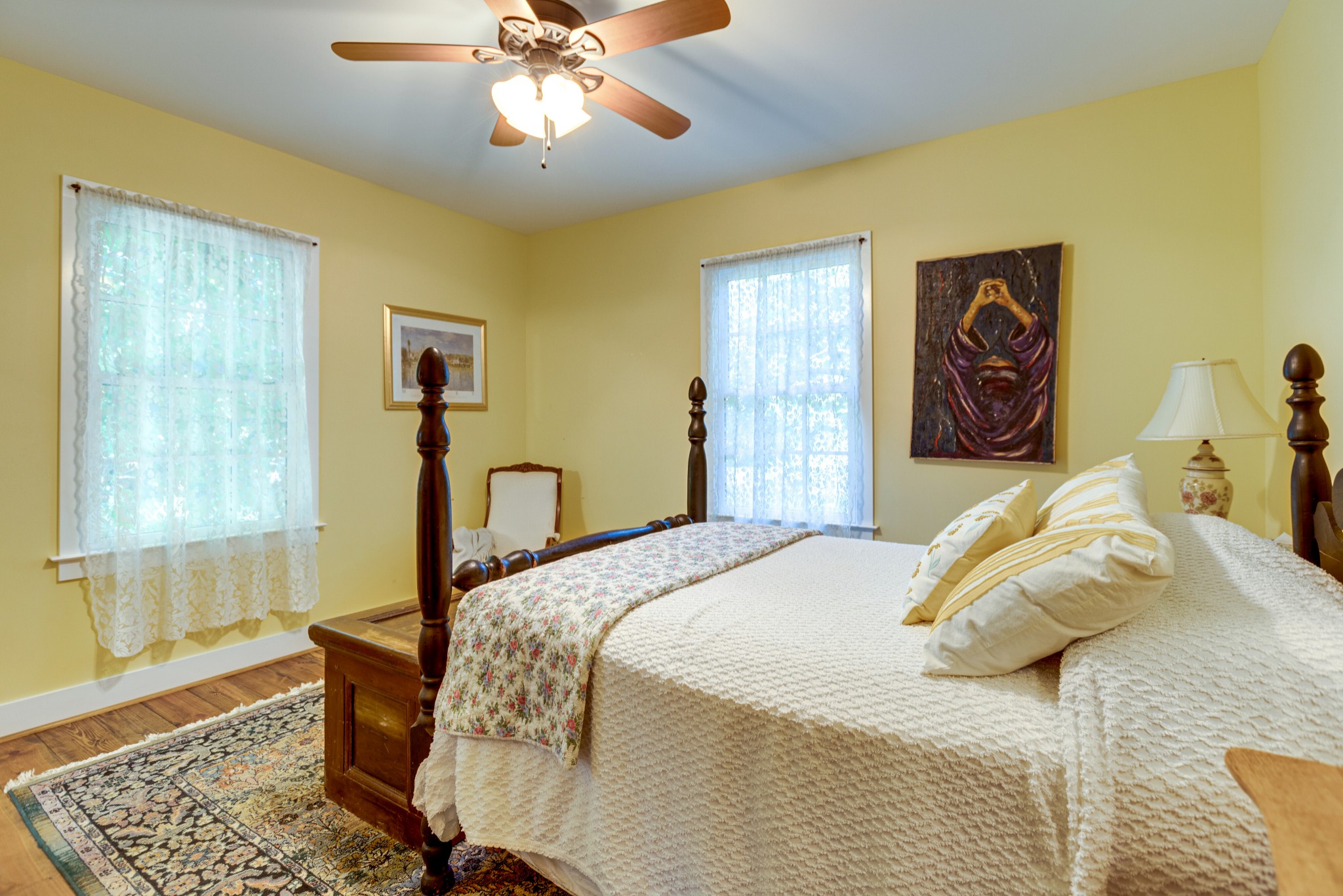 5184 Fire Tower Road Franklin, TN 37064 - Photo 24 of 53 a bedroom with a bed and a chandelier