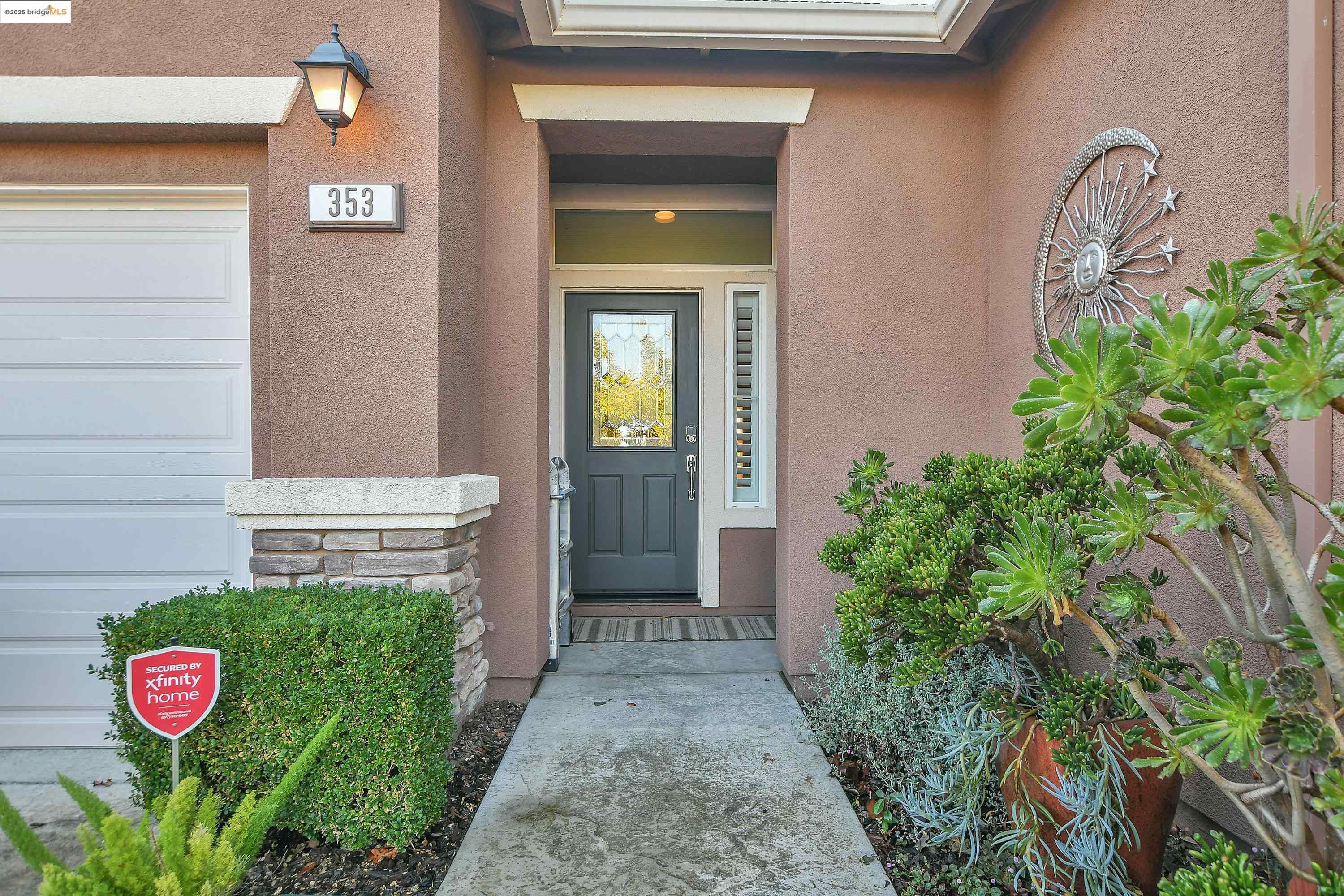 353 Desert Forest Court Rio Vista, CA 94571 - Photo 12 of 39 a view of a door of the house with potted plants