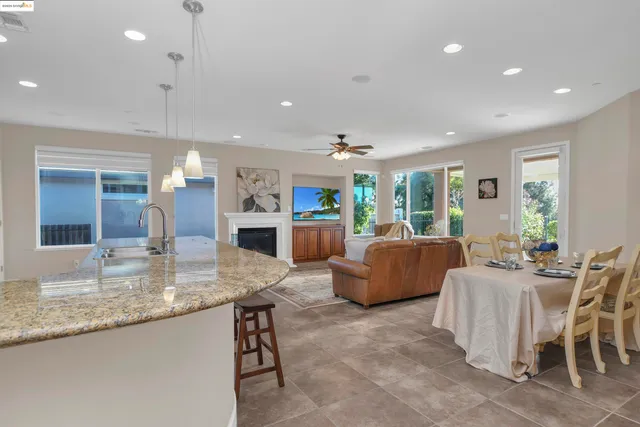 a kitchen with living room and furniture