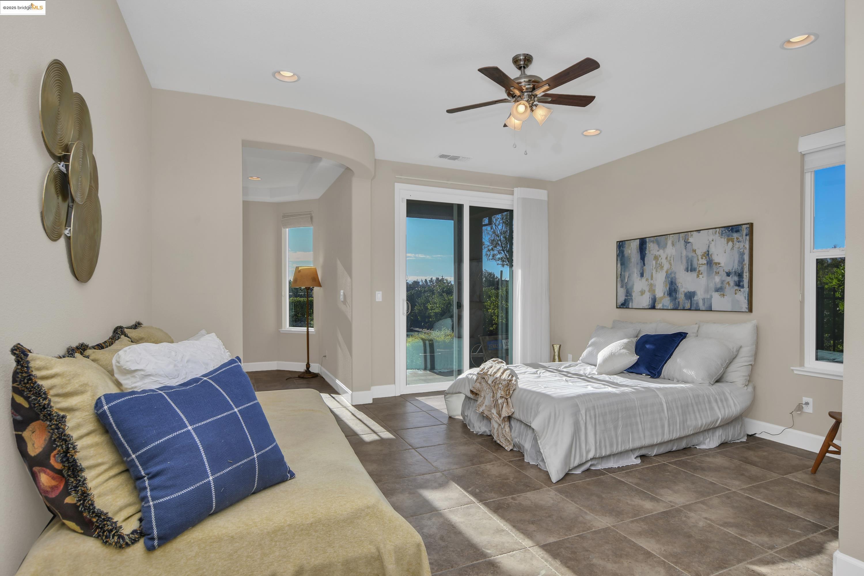 353 Desert Forest Court Rio Vista, CA 94571 - Photo 24 of 39 a bedroom with a large bed and a couch