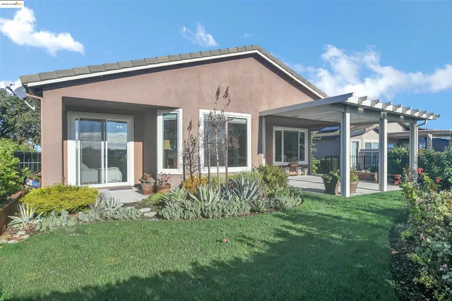 a aerial view of a house with a yard