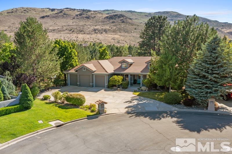 3521 South Cheechako Circle Reno, NV 89519 - Photo 1 of 40 a view of backyard with a barn and a mountain view