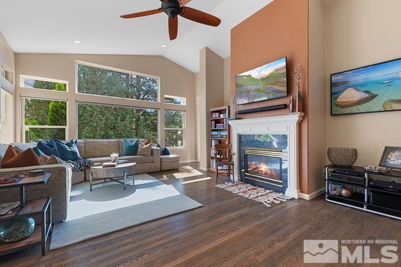 3521 South Cheechako Circle Reno, NV 89519 - Photo 11 of 40 a living room with furniture a flat screen tv and a fireplace