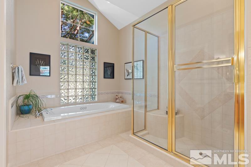 3521 South Cheechako Circle Reno, NV 89519 - Photo 23 of 40 a bathroom with a bathtub and a shower