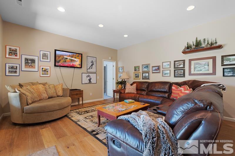 3521 South Cheechako Circle Reno, NV 89519 - Photo 24 of 40 a living room with furniture a couch and paintings on the wall