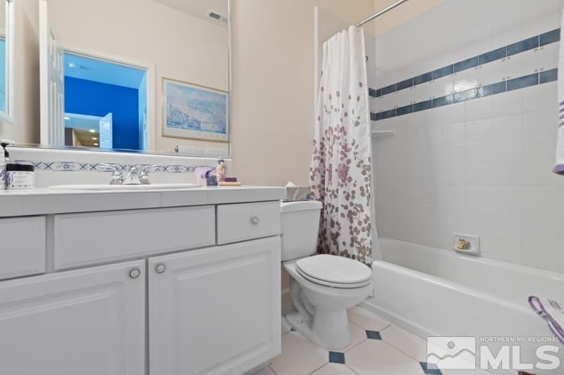 3521 South Cheechako Circle Reno, NV 89519 - Photo 28 of 40 a bathroom with a sink a toilet and shower