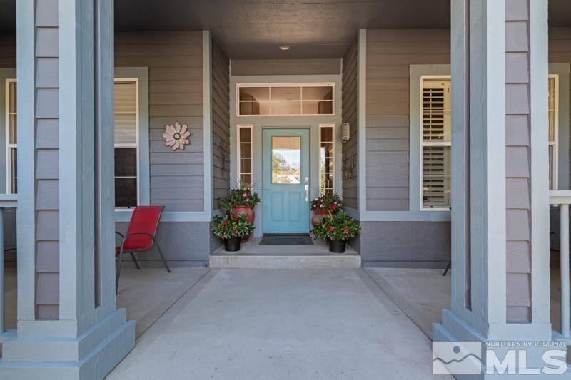 3521 South Cheechako Circle Reno, NV 89519 - Photo 4 of 40 a view of a brick house with chairs in front of door