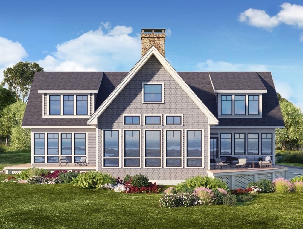 169 Atlantic Road Gloucester, MA 01930 - Photo 1 of 24 a front view of a house with a yard