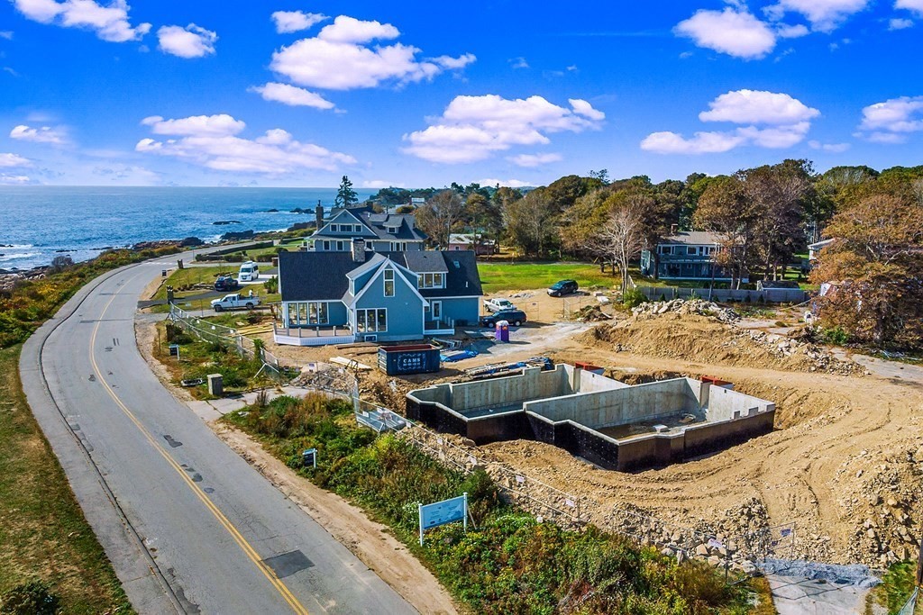 169 Atlantic Road Gloucester, MA 01930 - Photo 3 of 24 a view of a swimming pool with a patio