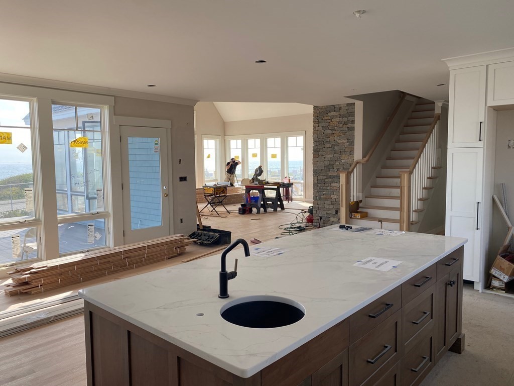 169 Atlantic Road Gloucester, MA 01930 - Photo 9 of 24 a kitchen with kitchen island a sink and a stove