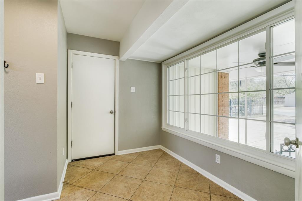 700 Ridgedale Drive Richardson, TX 75080 - Photo 26 of 32 Large mud/utility room connecting the garage to the house with a large window.