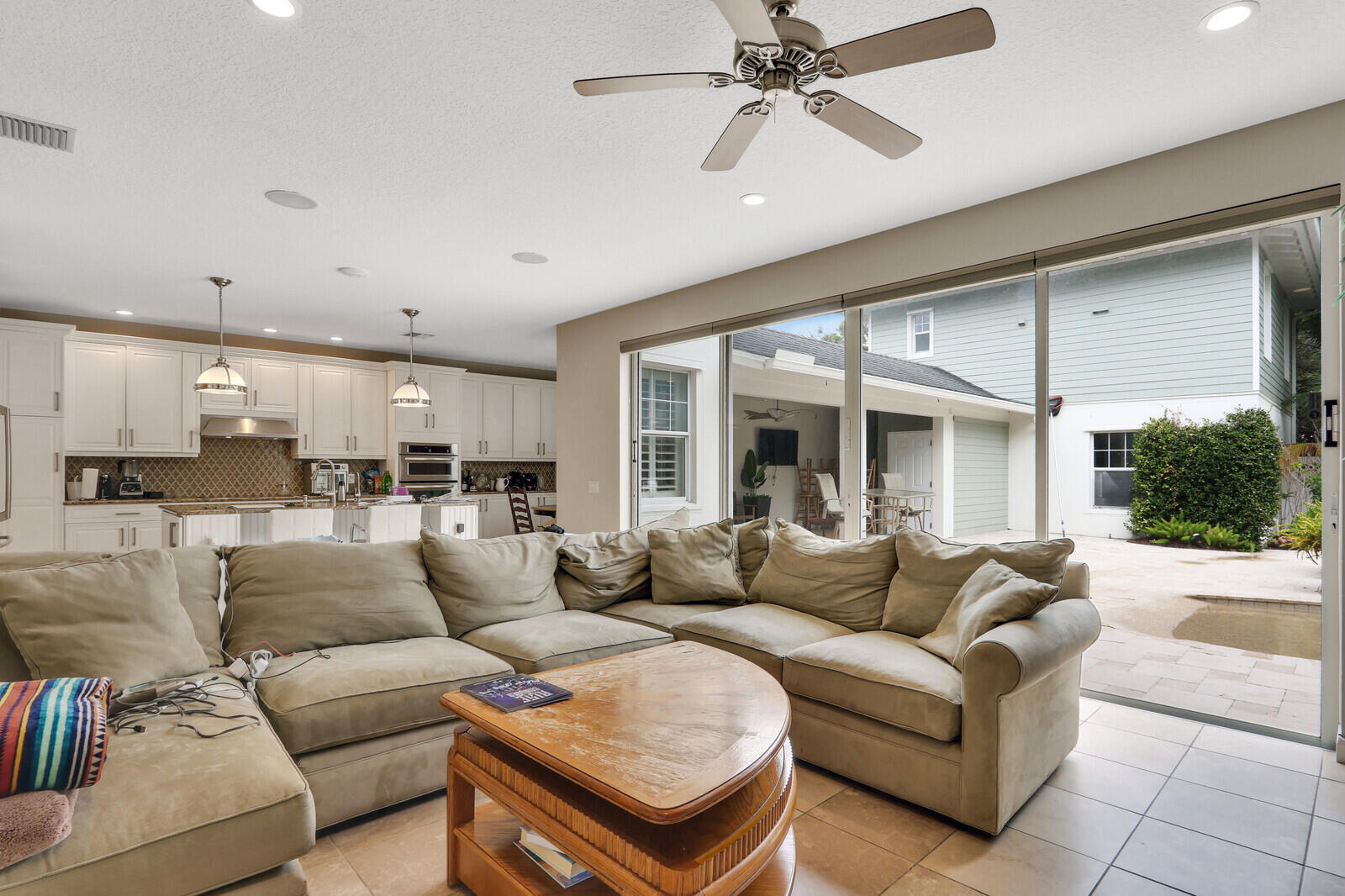 101 St Pierre Way Jupiter, FL 33458 - Photo 16 of 57 a living room with furniture and a large window