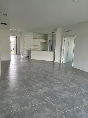a view of a kitchen with a sink and cabinet