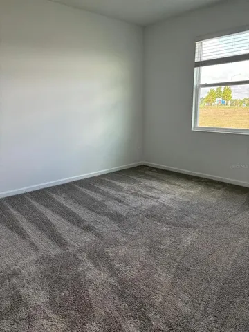 a view of a room that has a window in it