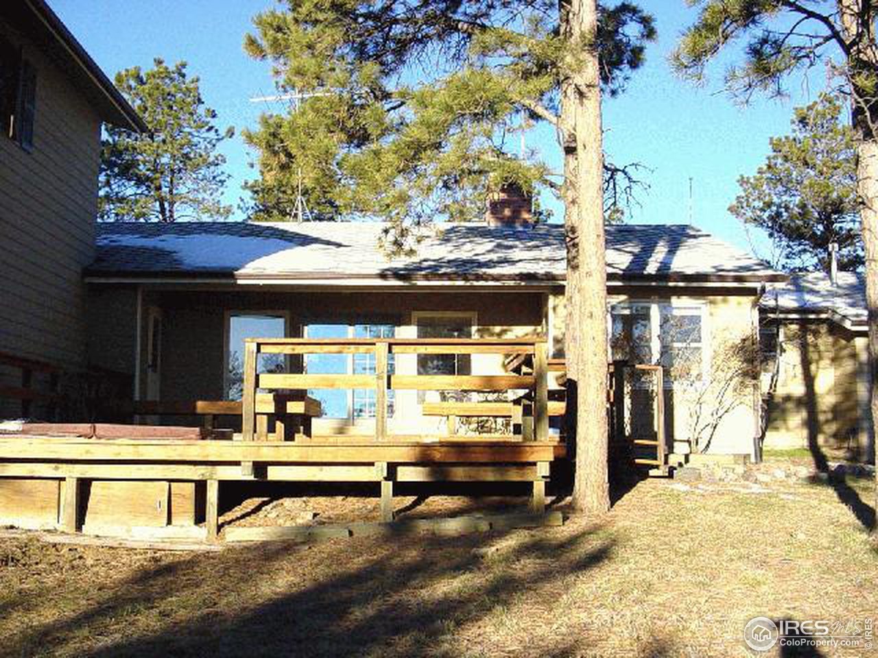228 Stratton Park Road Bellvue, CO 80512 - Photo 11 of 12 a view of a house with a patio and a yard