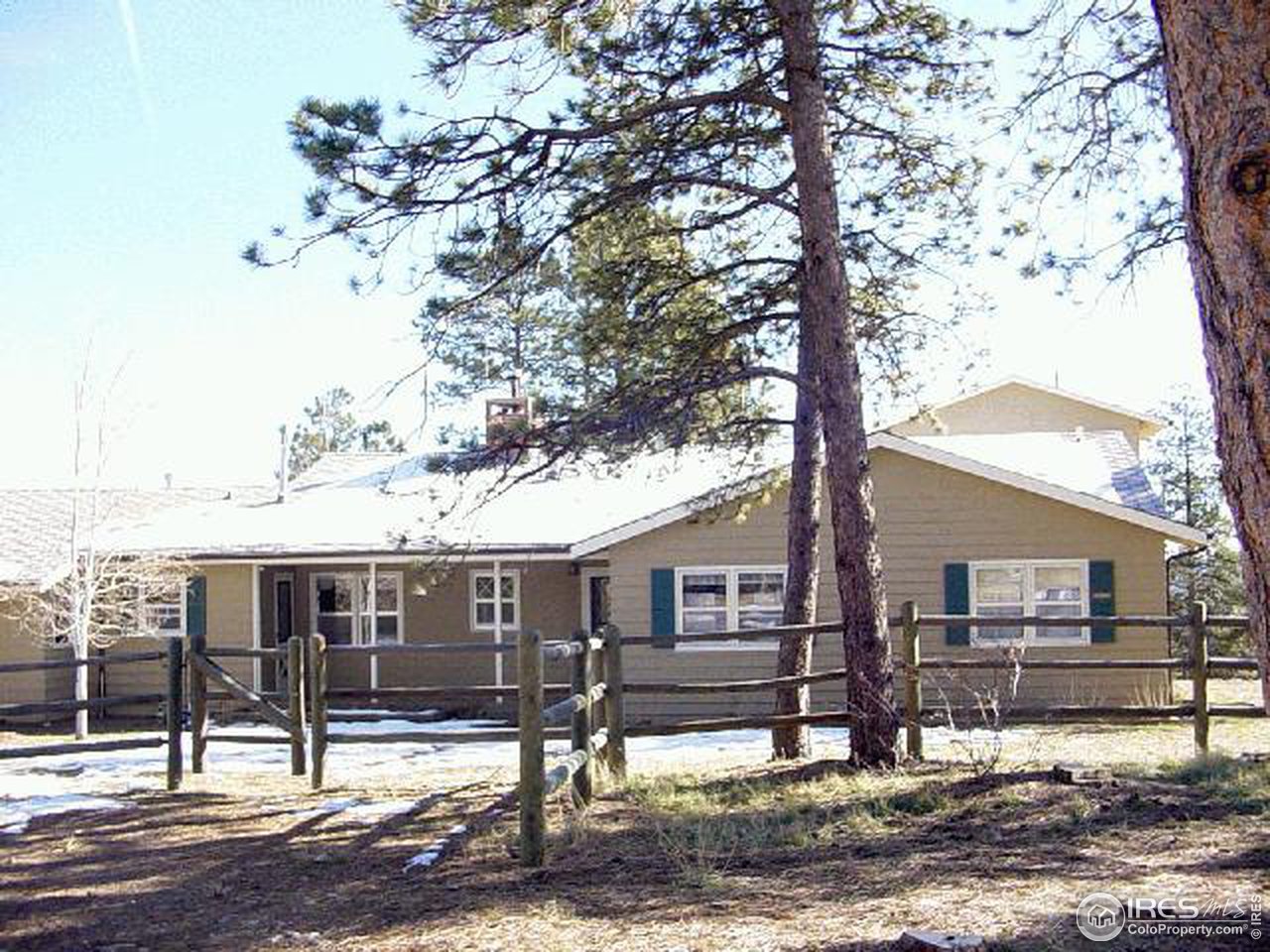 228 Stratton Park Road Bellvue, CO 80512 - Photo 3 of 12 a view of a house with backyard and trees