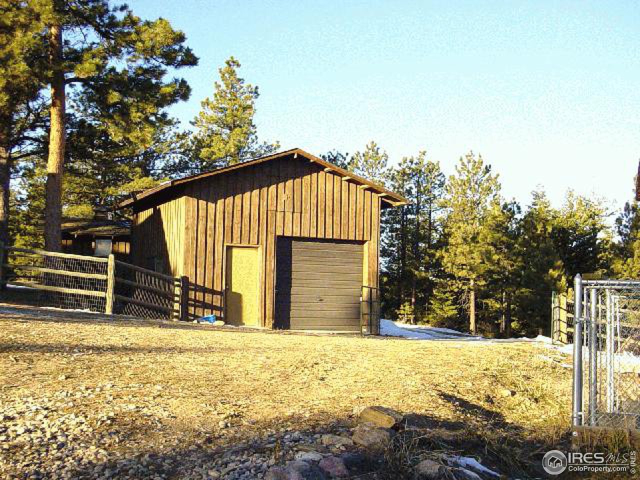 228 Stratton Park Road Bellvue, CO 80512 - Photo 6 of 12 a view of a house with a yard