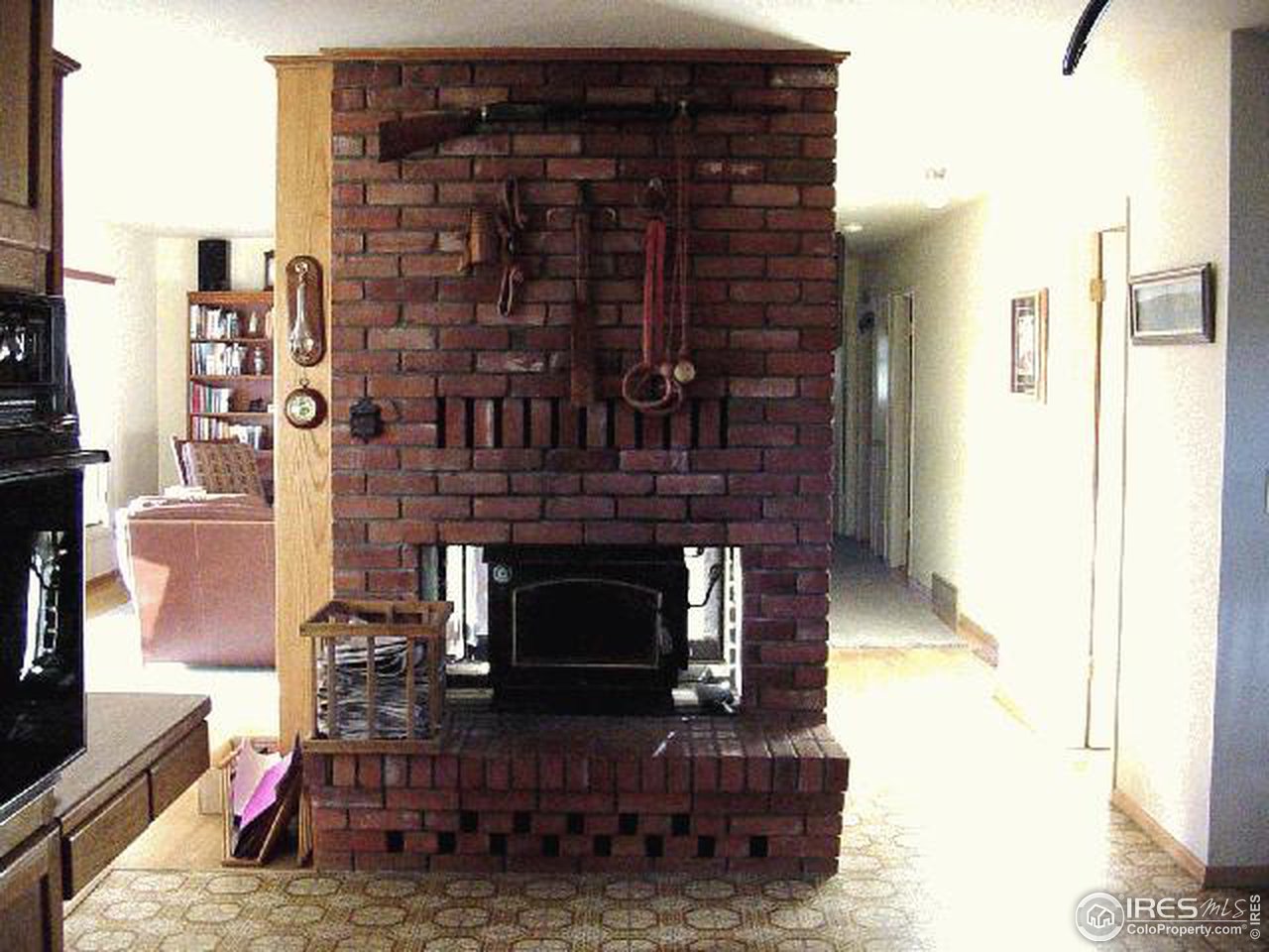 228 Stratton Park Road Bellvue, CO 80512 - Photo 8 of 12 a living room with furniture a flat screen tv and a fireplace