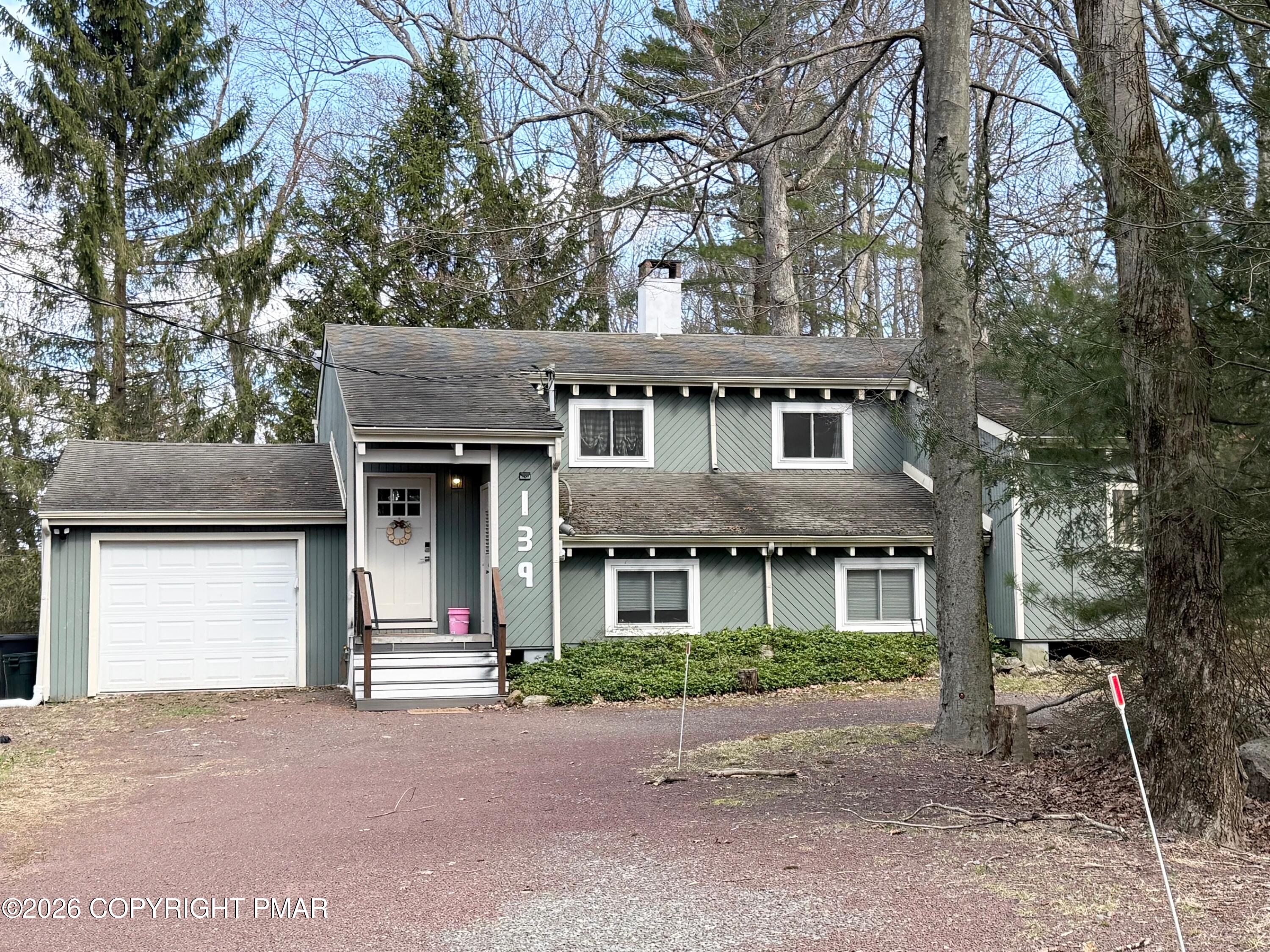 9 Sassafras Road Lake Harmony, PA 18624 - Photo 1 of 36 a front view of a house with a yard and garage