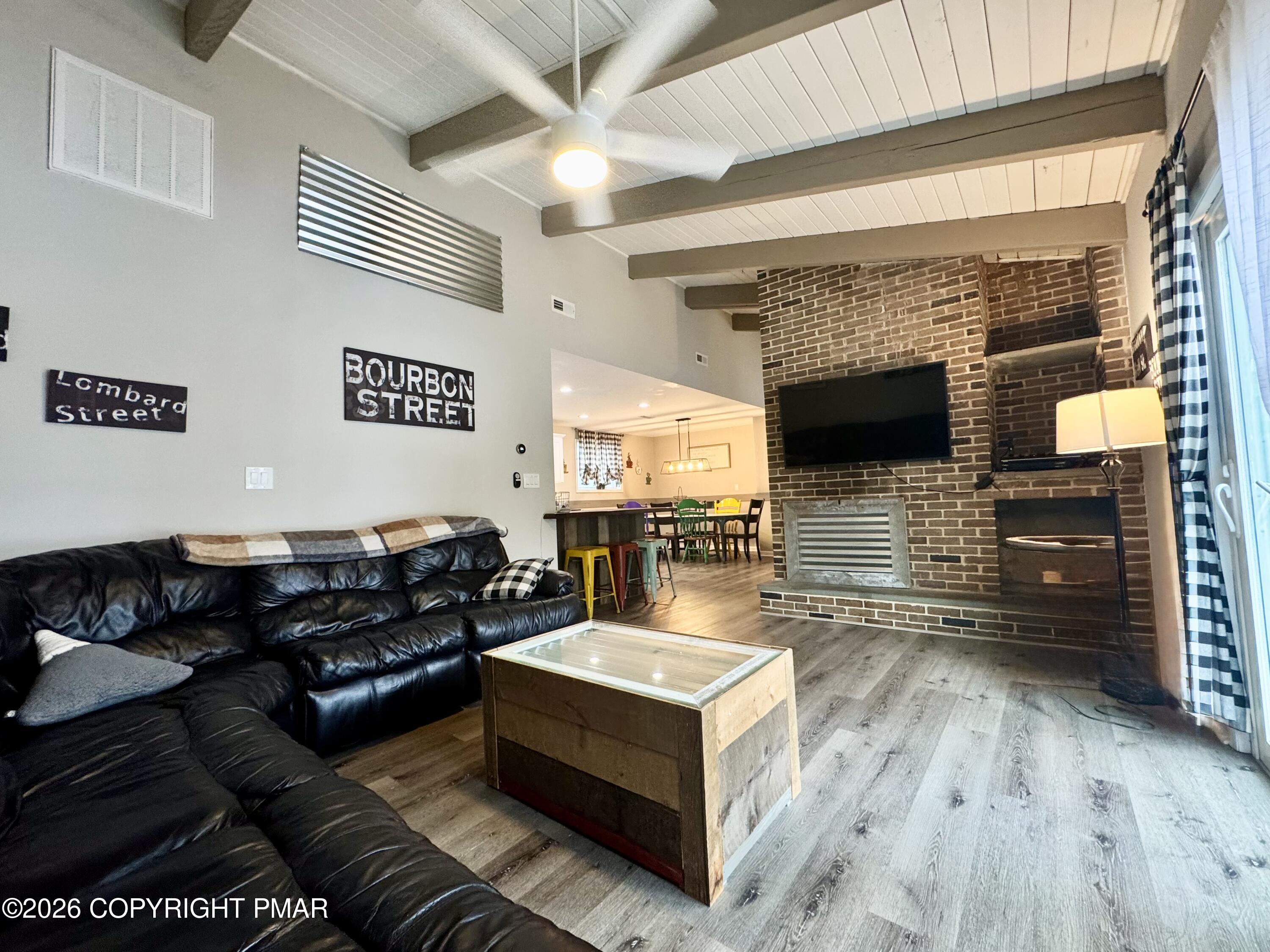 9 Sassafras Road Lake Harmony, PA 18624 - Photo 13 of 35 a living room with furniture and a fireplace
