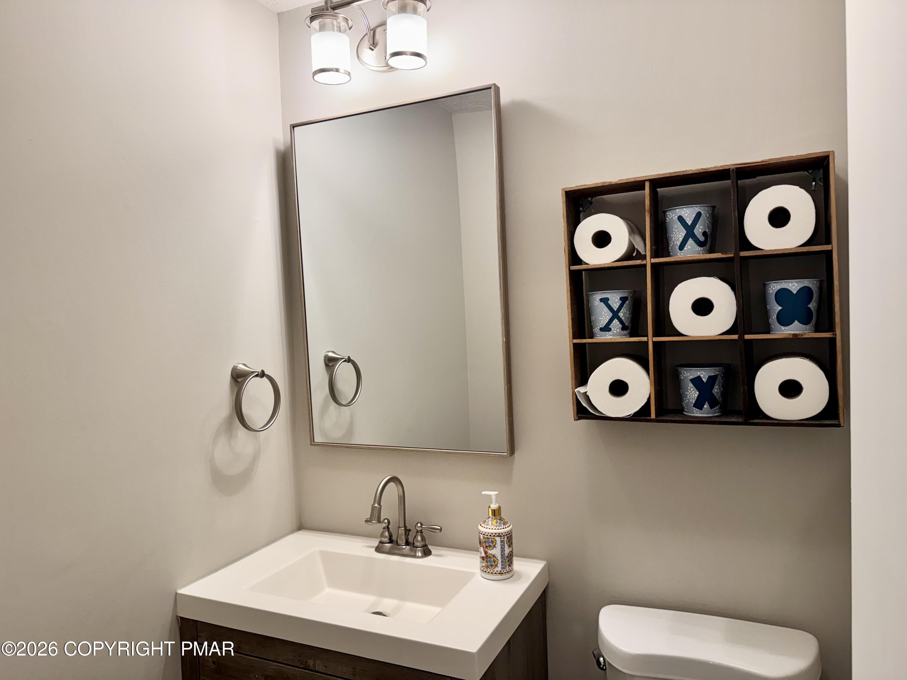 9 Sassafras Road Lake Harmony, PA 18624 - Photo 14 of 35 a bathroom with a toilet sink vanity and mirror