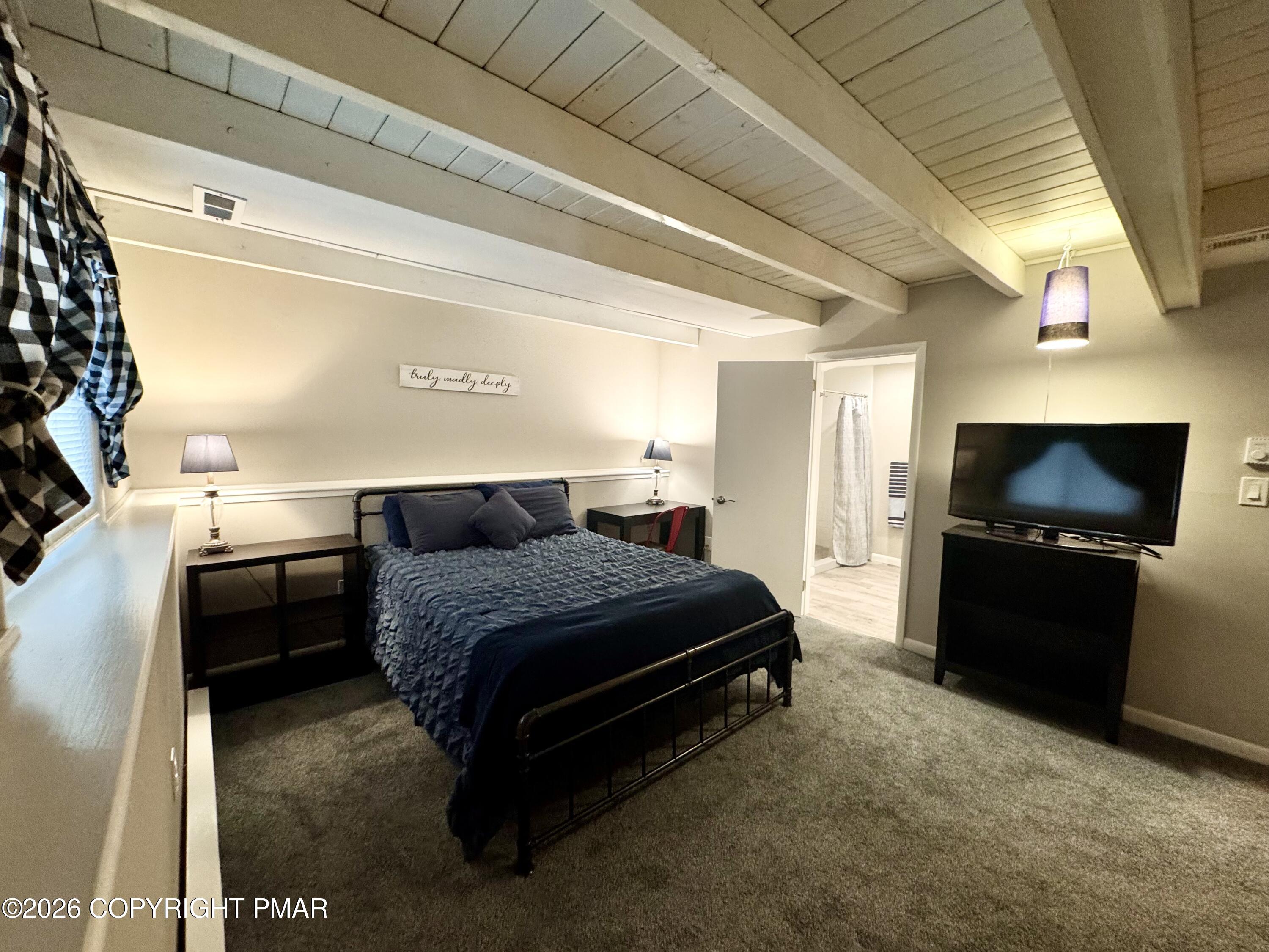 9 Sassafras Road Lake Harmony, PA 18624 - Photo 15 of 35 a living room with a bed and a television