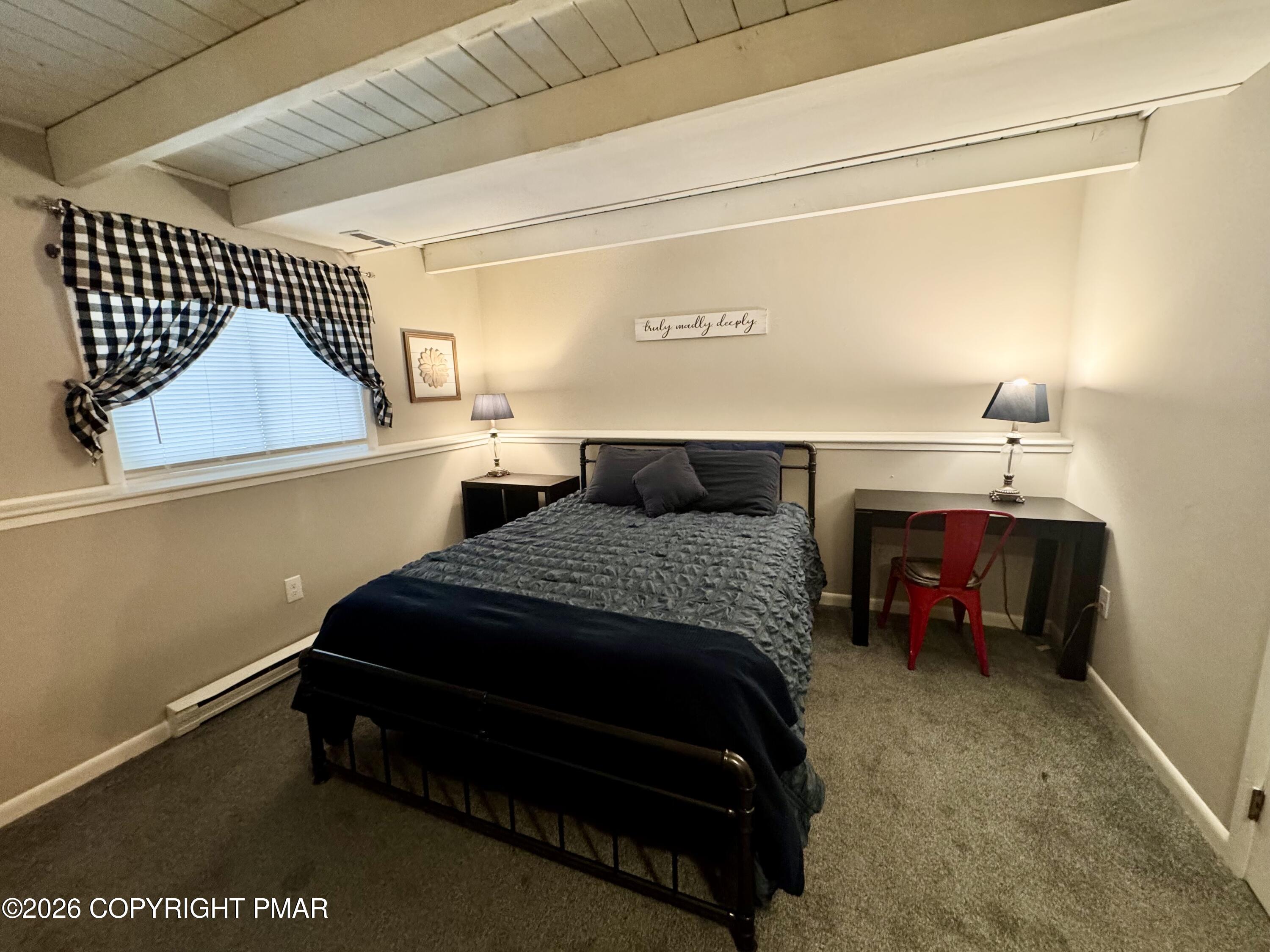 9 Sassafras Road Lake Harmony, PA 18624 - Photo 16 of 35 a bedroom with a bed and a night stand