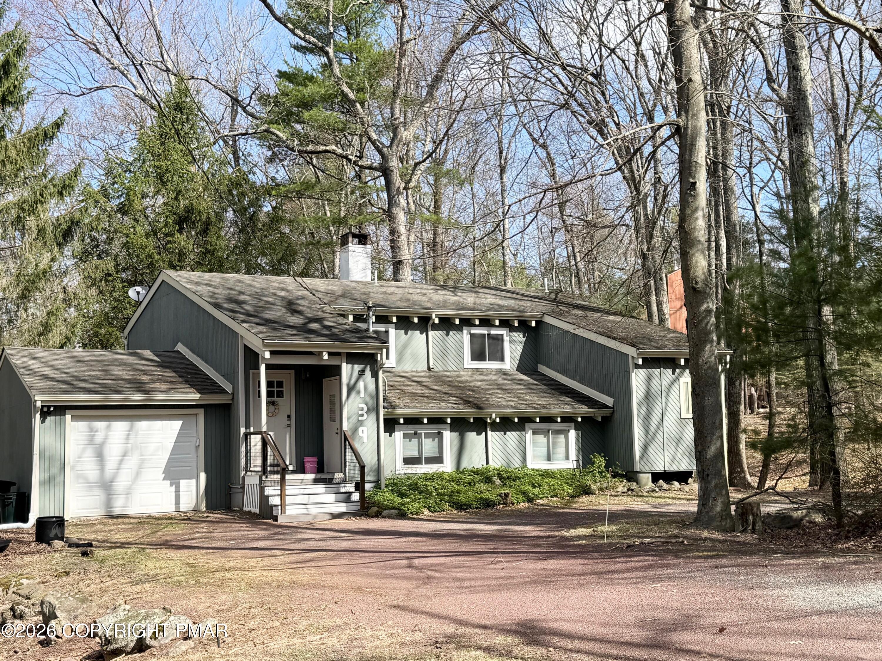 9 Sassafras Road Lake Harmony, PA 18624 - Photo 2 of 36 a front view of a house with a garden