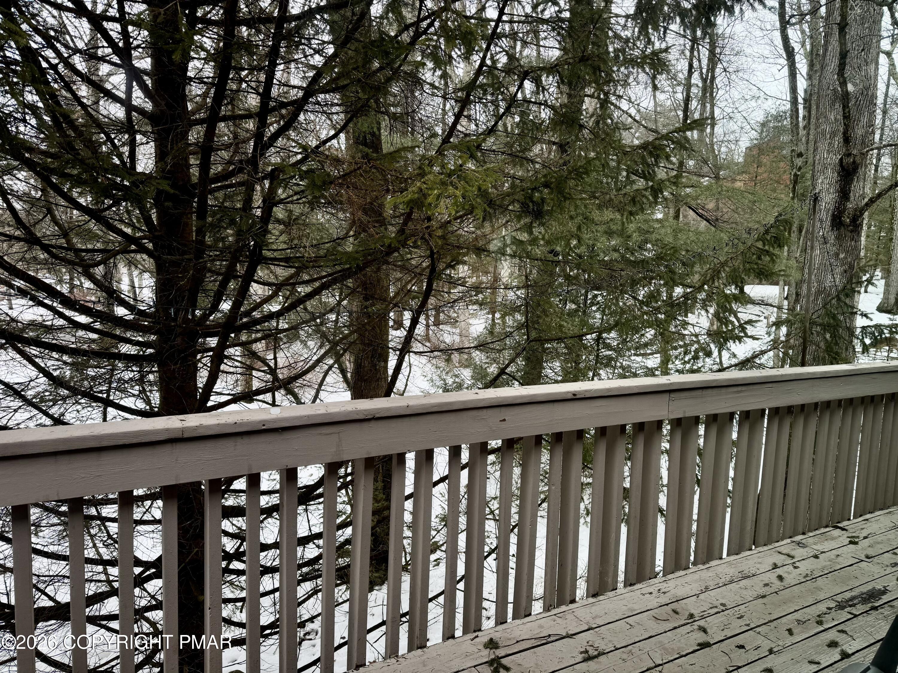 9 Sassafras Road Lake Harmony, PA 18624 - Photo 26 of 35 a wooden deck with trees in front of it