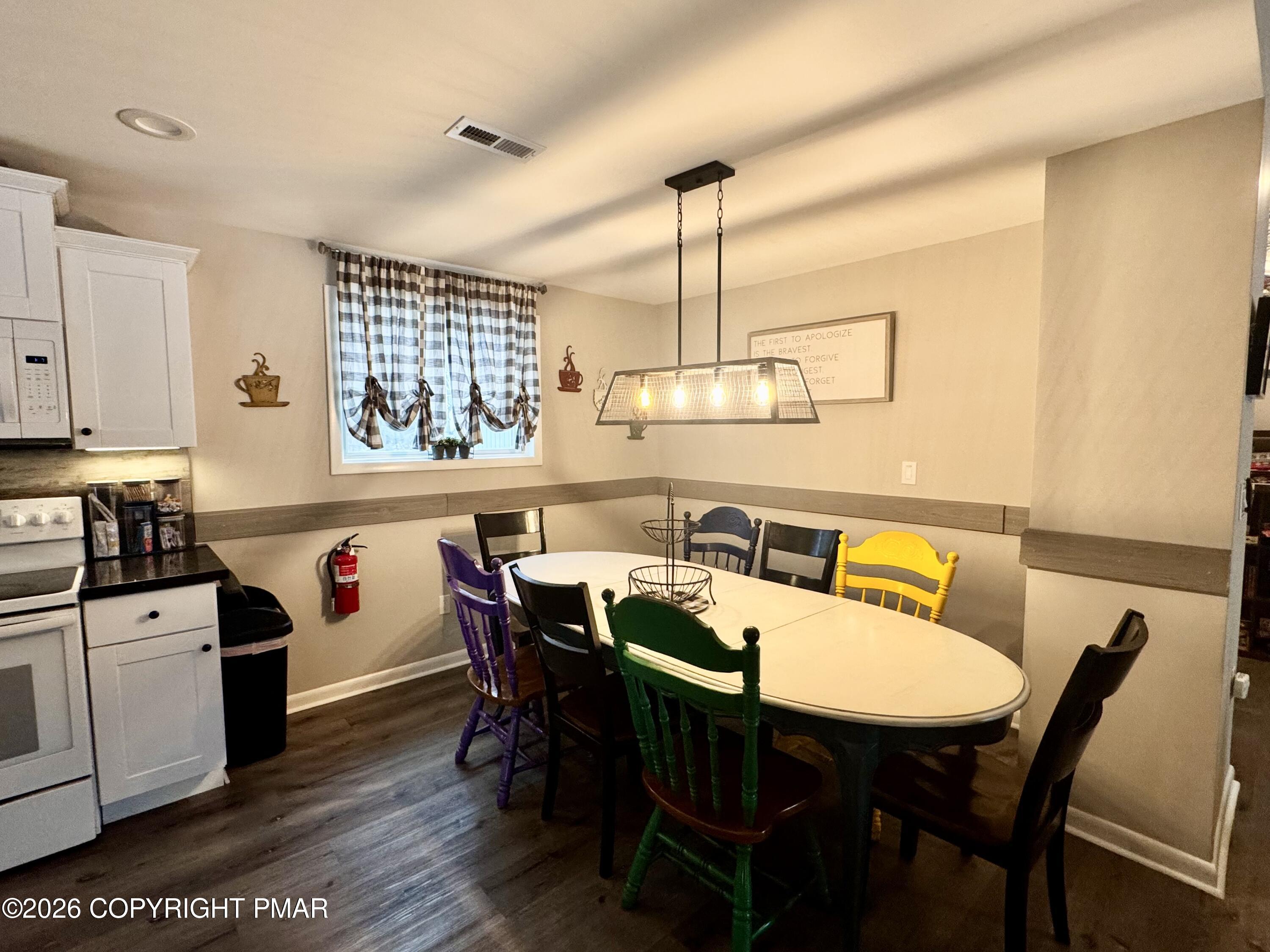 9 Sassafras Road Lake Harmony, PA 18624 - Photo 7 of 35 a view of a dining room with furniture window and wooden floor