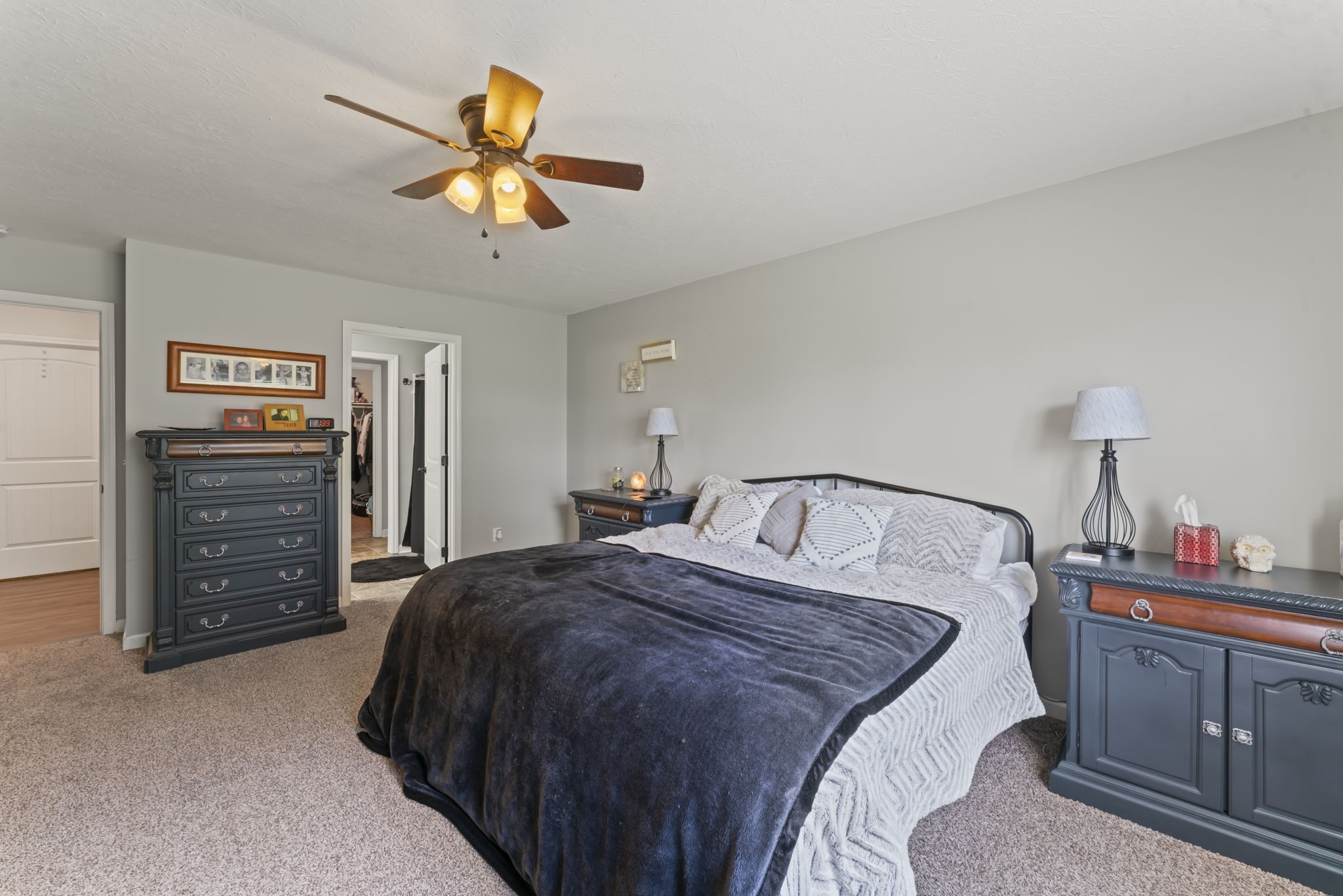 1070 Mt Vernon Road Bethpage, TN 37022 - Photo 12 of 20 a bedroom with a bed and a chandelier