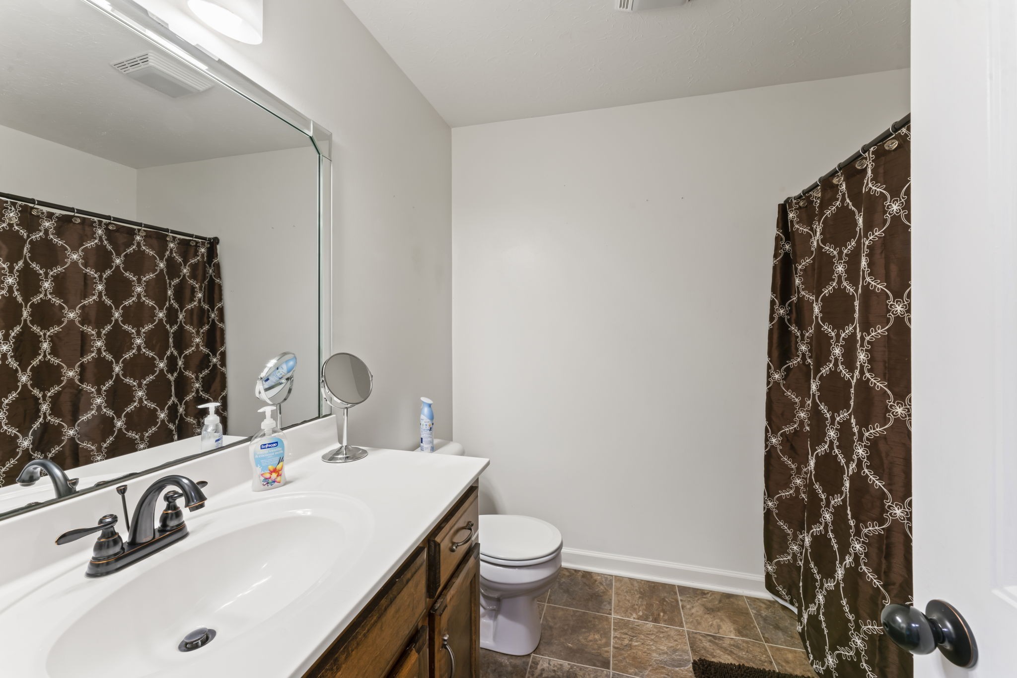 1070 Mt Vernon Road Bethpage, TN 37022 - Photo 16 of 20 a bathroom with a sink and a mirror