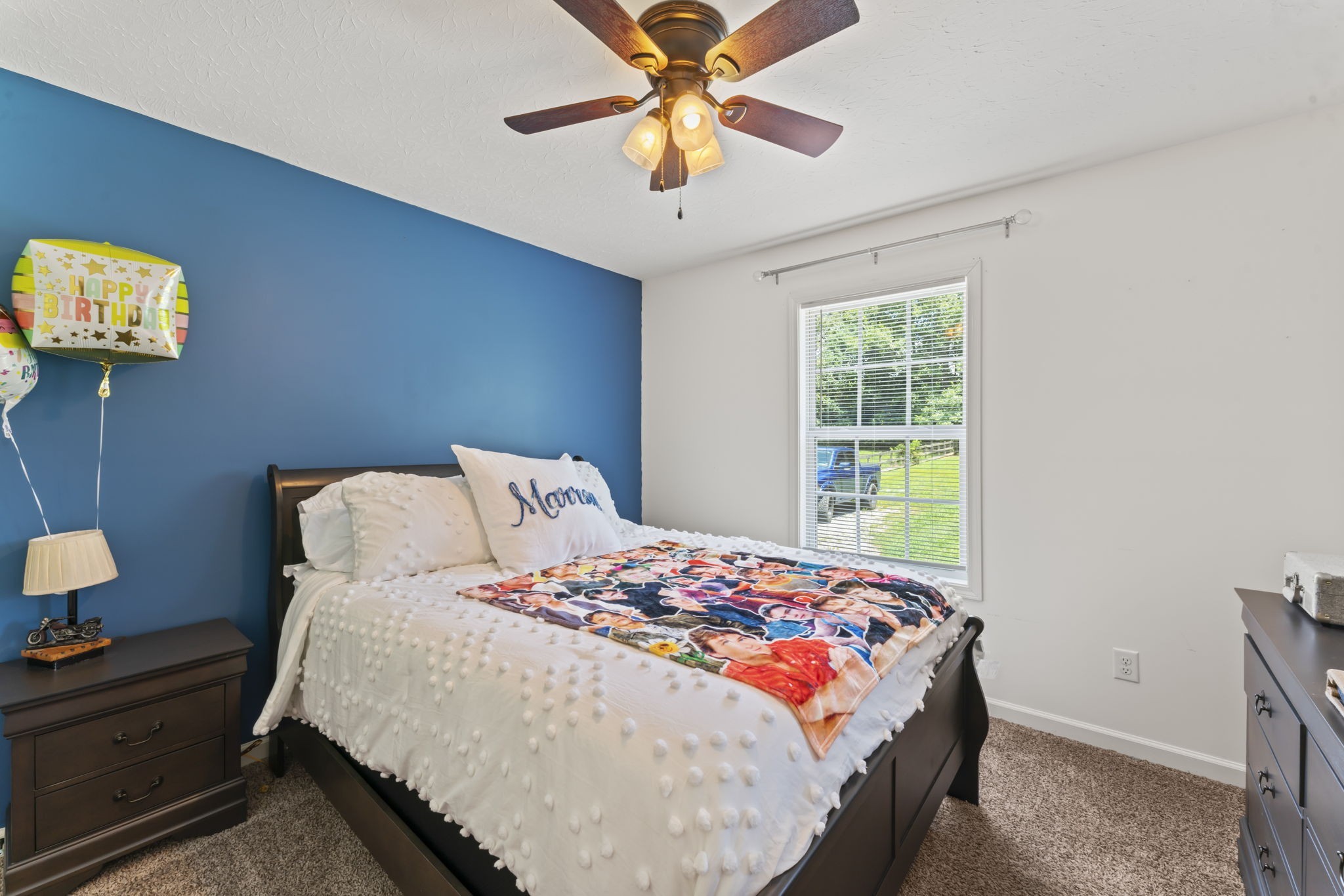 1070 Mt Vernon Road Bethpage, TN 37022 - Photo 17 of 20 a bedroom with a bed and a chandelier