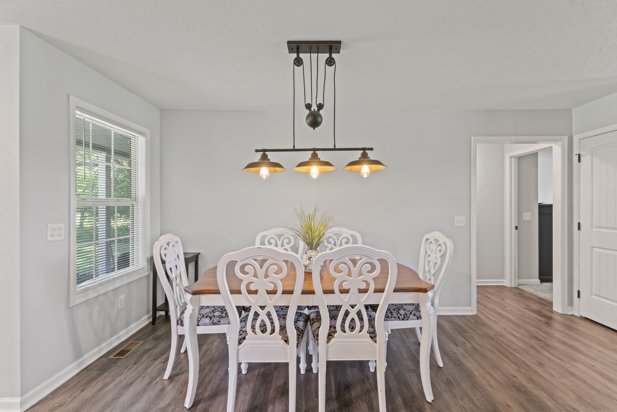 1070 Mt Vernon Road Bethpage, TN 37022 - Photo 8 of 20 a view of a dining room with furniture window and wooden floor