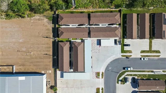aerial view of a house with parking area