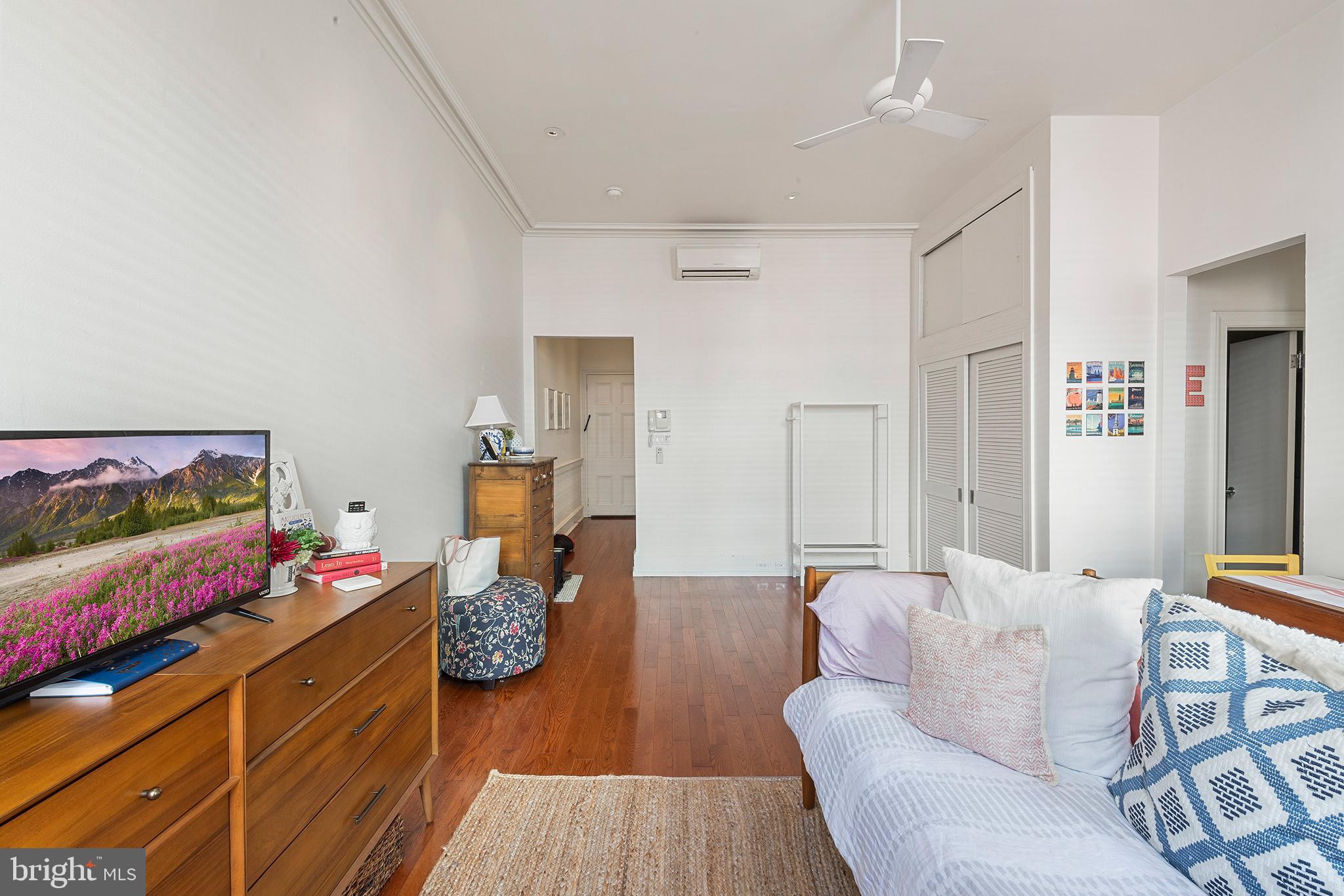 1810 Spruce Street, Unit 3F Philadelphia, PA 19103 - Photo 3 of 9 a living room with furniture and wooden floor