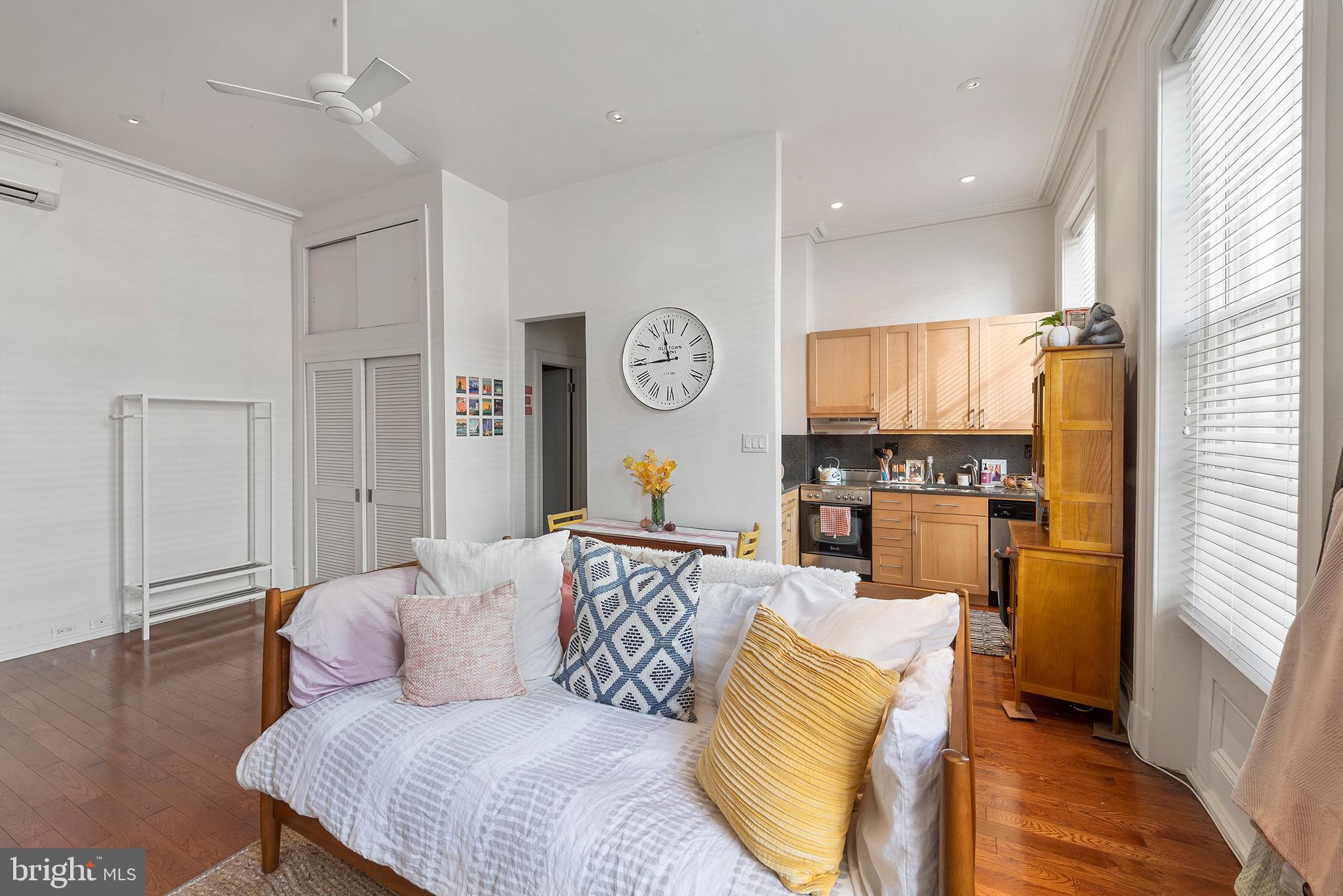 1810 Spruce Street, Unit 3F Philadelphia, PA 19103 - Photo 5 of 9 a living room with furniture and a kitchen
