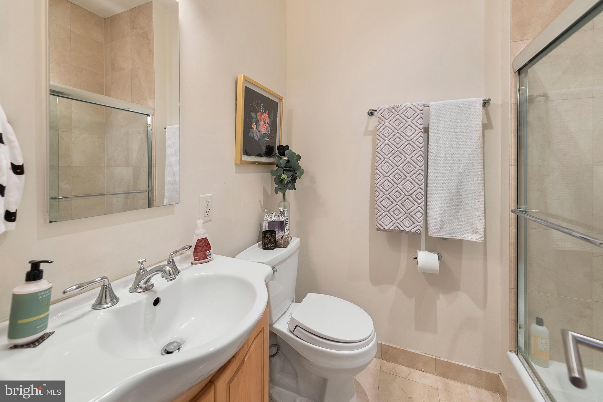 1810 Spruce Street, Unit 3F Philadelphia, PA 19103 - Photo 7 of 9 a bathroom with a sink toilet and shower