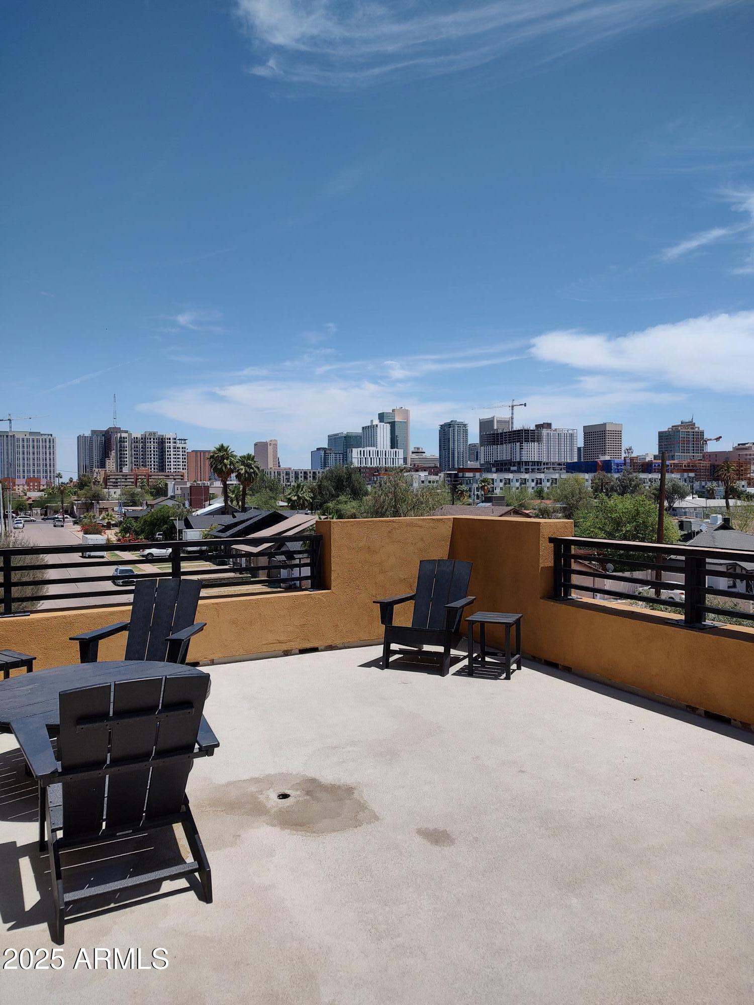 622 North 9th Avenue, Unit 101 Phoenix, AZ 85007 - Photo 18 of 18 a terrace with outdoor seating and water view