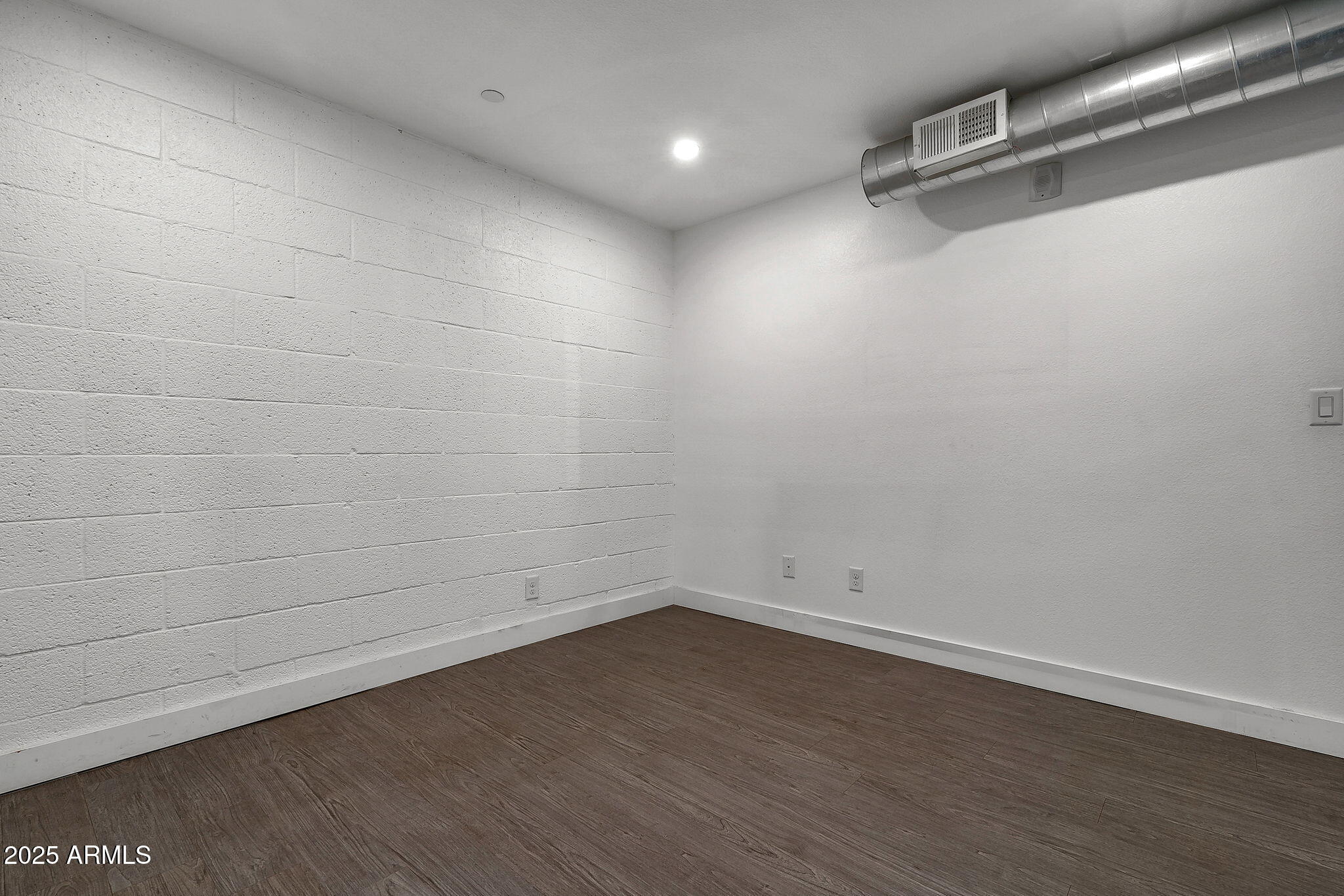 622 North 9th Avenue, Unit 101 Phoenix, AZ 85007 - Photo 6 of 18 a view of a room with wooden floor