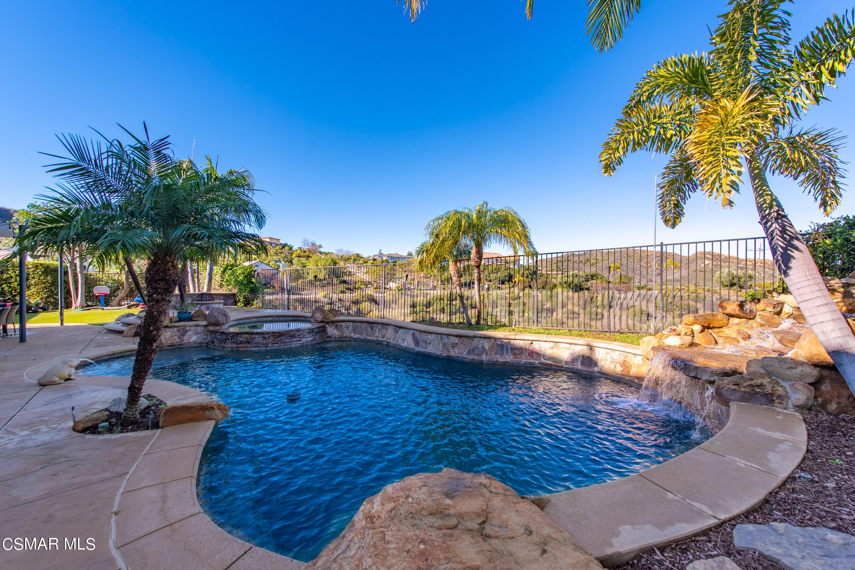 1997 Arielle Lane Simi Valley, CA 93065 - Photo 17 of 54 a view of a swimming pool with a table and chairs